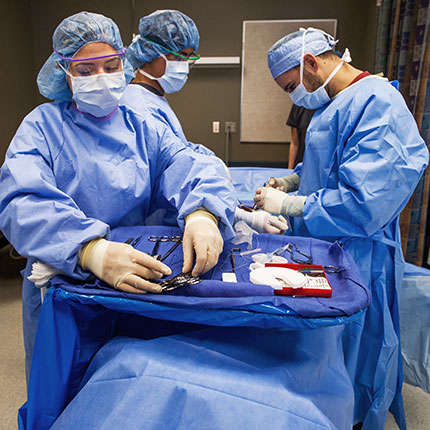 Surgical students performing a mock surgery.