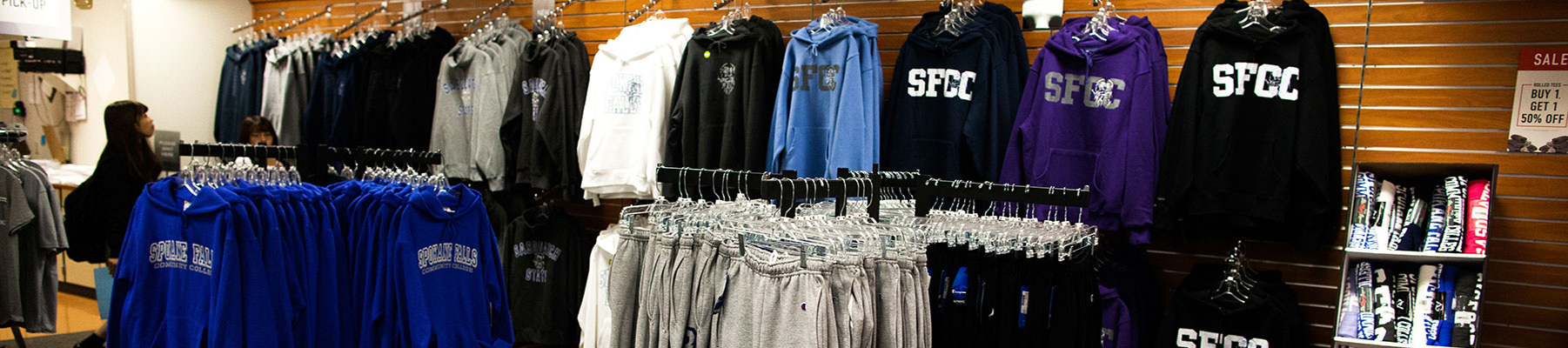 Racks of clothing in the campus bookstore
