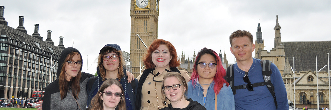 A group of 7 students facing the camera, behind them is the Big Ben clocktower in London.