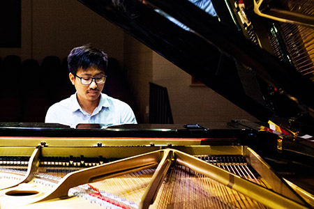SFCC student playing grand piano
