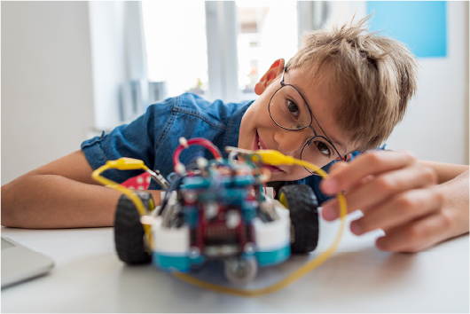 a young boy working on robotics.