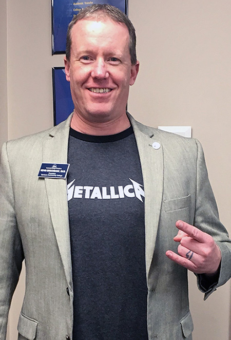 Spokane Community College that President Kevin Brockbank wearing a Metallica t-shirt
