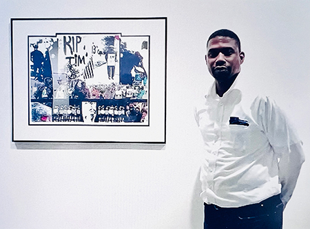 Artist Harris Wiltsher standing next to artwork