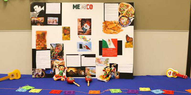 An information table with a poster on Mexico