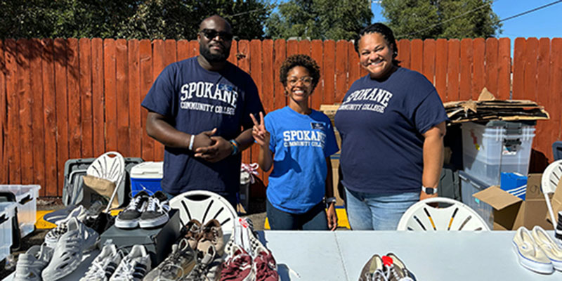  Debbie, Elysee, and Priya volunteering at The Way to Justice's Back to School Drive.