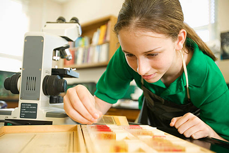 Student preparing microscope slides.