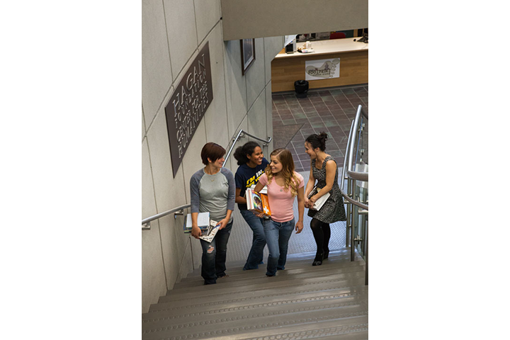 Library, students going to upper level