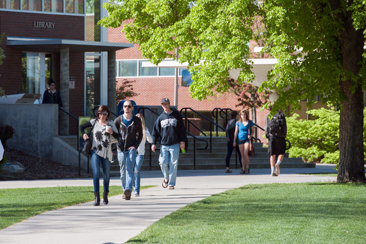 Students walking in area behind the Library