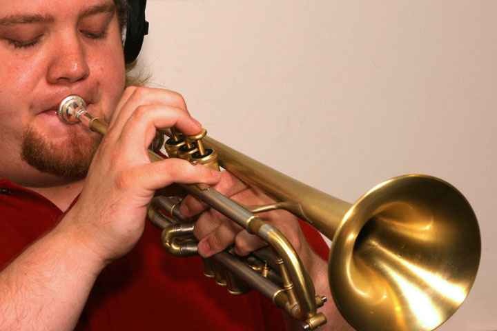 Musician practicing trumpet