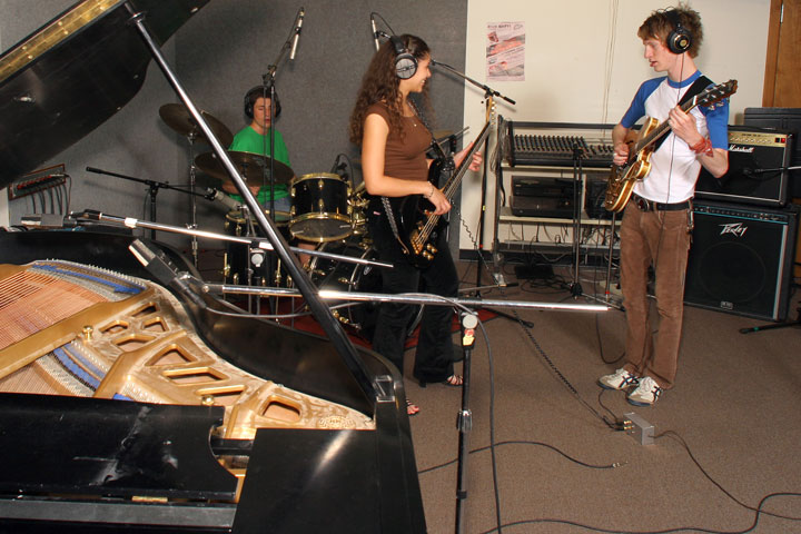 Three student musicians practicing