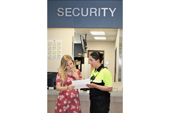 Two staff members at Campus Security Office