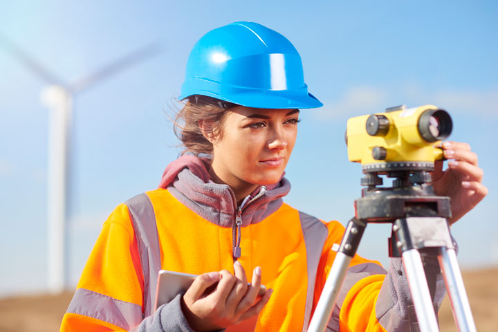 Engineer with surveying equipment