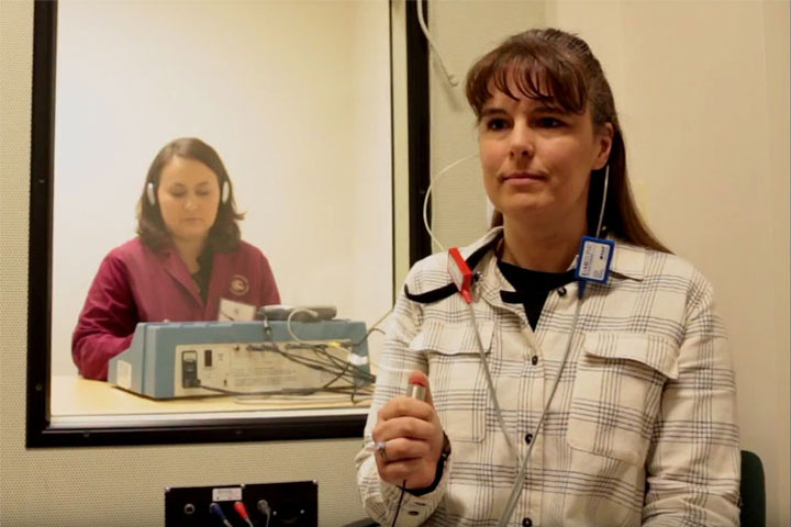 Hearing Instrument specialist conducting a hearing test