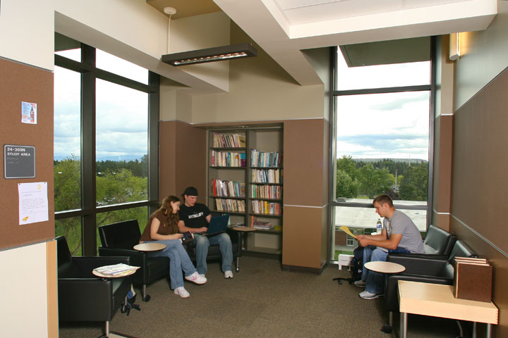 Three students sitting in study area on upper level