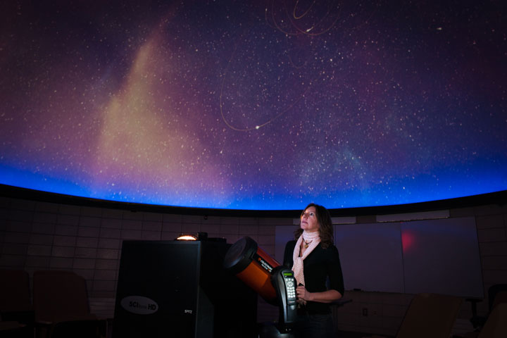 Presenter showing night sky in Planetarium