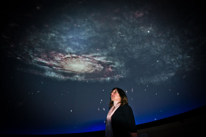 Presenter showing galaxy in planetarium presentation