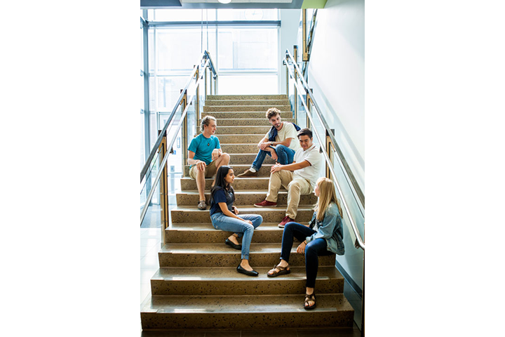 Five students on stairway in Building 30